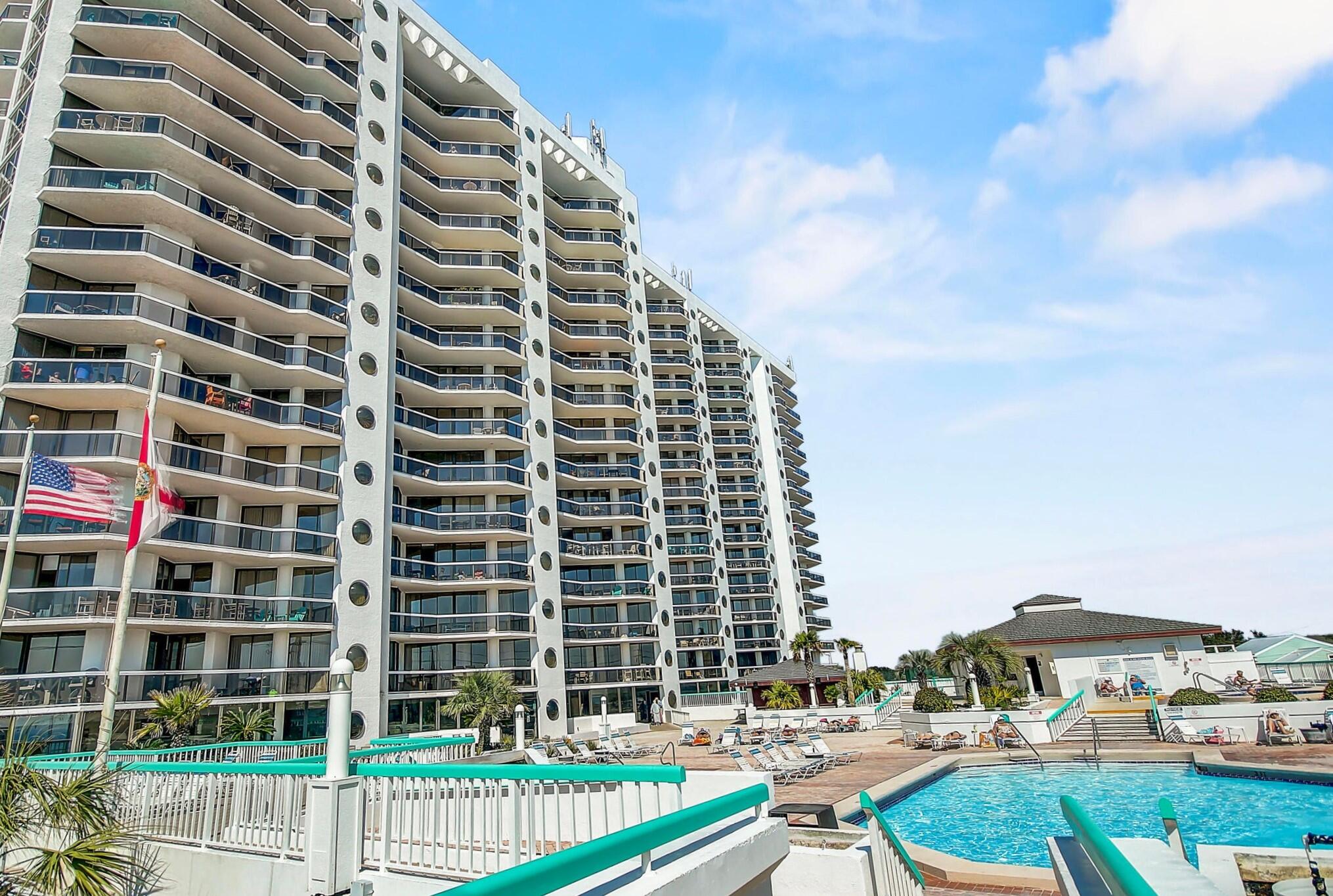 Motivated Sellers! Impeccably remodeled and professionally furnished by Sugar Beach Interiors, this ground floor unit features a rare large private patio that opens to the rear of the building and is just 100 yards from the beach. Recent upgrades abound, including: Removal of Popcorn Ceilings, Fresh Paint Throughout, Enhanced Cabinet Hardware and Trim work, New Interior Doors, Stylish (LVP) flooring, Updated Sinks and Countertops in the kitchen and bathrooms, Modern Shower with Frameless Tempered Glass Door, Upgraded Shower Drain and Plumbing, New Water Valves, Contemporary Vertical Blinds and Custom Shelving, New HVAC unit with Smart Thermostat. Rental projection estimates are 40K - 50K. Amenities: SPA, Pool, Fitness Center, Laundry, BBQ Area, Restaurant, Tennis and Private Beach.