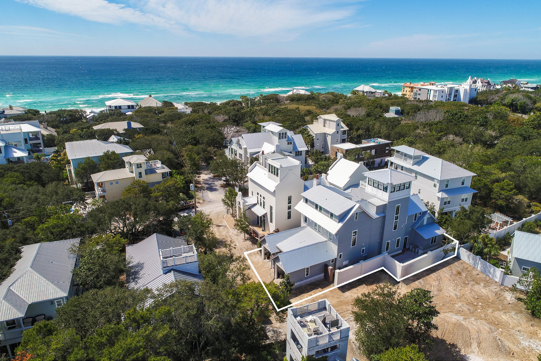 NEW CONSTRUCTION just completed in December 2018! Luxury fit & finish! Seller has furnished first floor (living & master br)! Offering fabulous Gulf views from one of the highest elevation points in Old Seagrove, this luxurious new construction home, designed by Matt Savoie and built by Alex Rice, is now complete. Leaving no detail unturned, this 5,275 square foot masterpiece has everything you would expect in a new $3M home: Five Sub-Zero refrigerators & four wet bars, one on each floor! Blue Star gas stainless range, security system w/ 8 cameras & Sonos wireless sound system. Exterior is 1'' cedar plank with stained dead-head Cypress soffits, TuffMax Rib metal roof, JeldWen high impact windows and accordion doors at poolside with two courtyards,