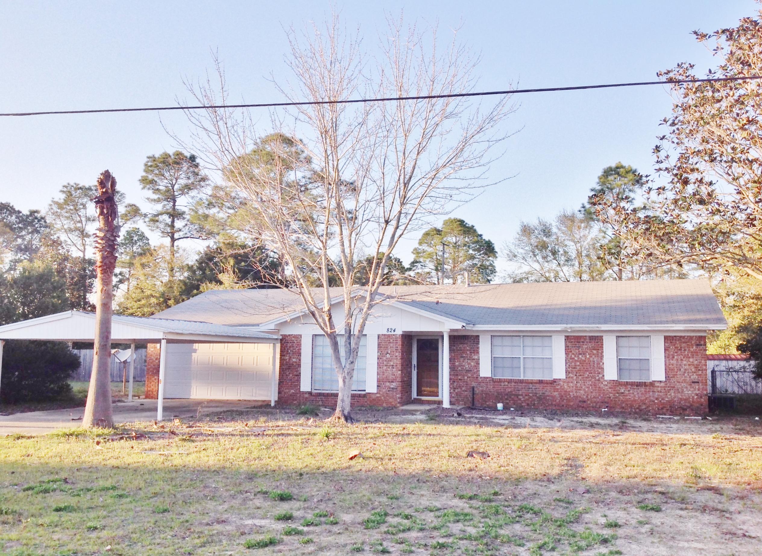 Calling all investors! The possibilities are ENDLESS! Situated on a HUGE lot over one third of an acre in the heart of Niceville, SO convenient to everything! This solid brick ranch style, 1 story home features an eat-in kitchen, 3 bedrooms, separate dining room and separate living room. Emphasize the cool vintage bathrooms and parquet wood floor in the Master bedroom, or modernize it to your taste. There's a 2 car garage AND 2 car carport. Plus, the garage features a ton of cabinets for storage and organization. Pull down attic stairs for more storage, AND there's another storage closet in the garage as well! The backyard has plenty of room to accommodate a pool, gazebo, pergola, outdoor kitchen, or ALL the above! Bring your imagination and come have a look today. You'll be glad you did!