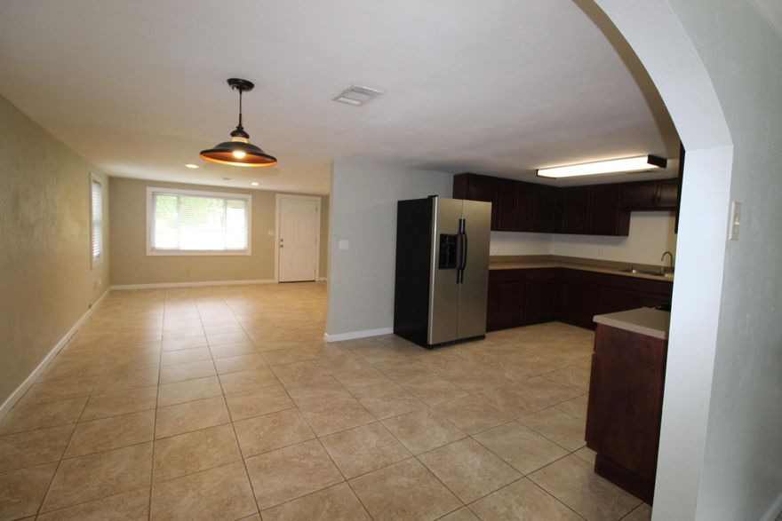 A RARE FIND on the outskirts of Bluewater Bay in Okaloosa County Florida. The ''WOW'' is a one-half acre home site featuring a lovely 4-bedroom home and detached 2-car garage. Located just a few blocks from the Mid Bay Bridge by-pass. This home is built above grade, well maintained and move in ready. As you drive onto the extended and wide drive way you will admire the size of this home site. There are endless possibilities to expand and still obtain the privacy you desire. Large open porch to relax on the quite summer nights. Step inside and relax in the large family room. To the left is one hall to all the bedrooms; two rooms feature brand new carpet. Master Bedroom is set in the rear of home with view of the back yard. There is plenty of room in the Kitchen to add a center island the refrigerator will stay. The dining room is open to the Kitchen and bonus room that boast French Doors leading out to the large deck which as a gas bib for a grill or out door kitchen. The laundry room is just off the opposite side of the kitchen. Nestled in the far back corner of the fenced lot is a two-car garage or you may want to make use of it as a workshop. There are mature trees to provide nice shade from the bright Florida Sun. Metal Roof and double pain windows will add some savings on utilities.