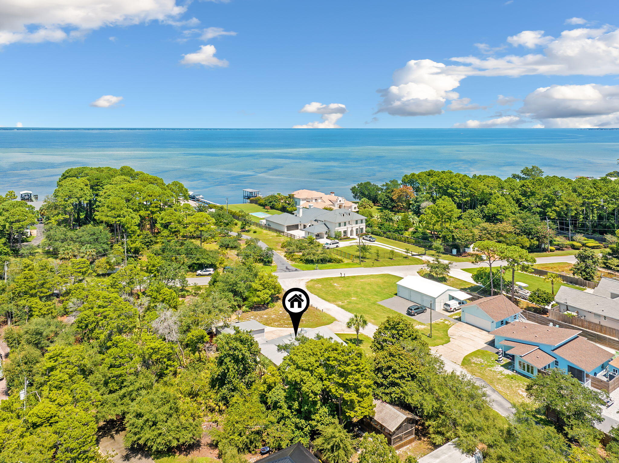 If you are looking for *** SERENITY *** in the heart of Destin / Miramar Beach you have found it. This half acre plus lot is laid out perfectly where you can enjoy every square foot of it. This adjustable 2/3 Bedroom 2 Bath Home with an open floor-plan makes the home seem like it is 2,000 square feet. The Roof is 9 years old and the AC & Water Heater are 3 years old. The Home has been remodeled with multiple upgrades. Do yourself a favor and take a look at all of the pictures and you will see exactly what this property has to offer. Included on the property is a House, a Breezeway, a Detached Garage (Work Shop), a Screened in Gazebo, and a Large Storage Shed. This special piece of property is very close to the Bay where you can enjoy gentle breezes. Bring your Boat and RV!! NO HOA
