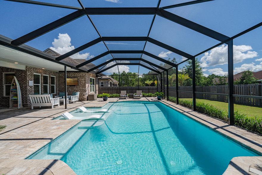 Welcome to Florida living at it's finest! Make a splash with this meticulously maintained Randy Wise built home featuring a stunning enclosed pool & extended lanai! This home is located in the Meadows at Hammock Bay.  It is just as beautiful inside as it is outside. The open concept kitchen features quartz counter tops, Fridgaire professional series SS appliances, gas cooktop, farmhouse sink & a coffee/wine bar.  When stepping out onto the back patio, you enter into your own piece of paradise. The Ozone pool features a Bahama ledge and enclosure with an additional 1,000 sqft of pavers.  There is an additional gas hook up perfect for grilling.  BONUS: the gorgeous wicker furniture and TV convey! The upgraded lot still offers plenty of room for a shed, playset or trampoline. The sellers spared no expense on their backyard oasis.  You do not want to miss this amazing home!