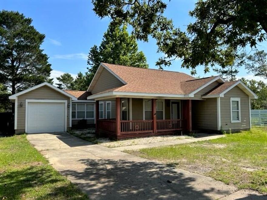 Located in Oakwood Hills and only 5 miles from the interstate exit at Mossy Head or 7.5 to 331 Hwy in Defuniak Springs. This house is a rare find! Situated on a paved road with beautiful trees and easy access. The lot is over sized with beautiful large trees for shade and an awesome wrap around front porch to enjoy. The backyard is fenced for your furry friends or for a large garden. The possibilities are endless. Take a look at the pictures of the well designed floor plan with master on one side and the two other bedrooms on the other.  The master bathroom with clawfoot tub and separate walk in shower is impressive. Come see for yourself!
