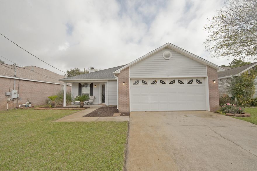 This well-cared for home is minutes from Eglin AFB, beautiful beaches, and about a mile west of Hurlburt Field. The open living room and dining area welcomes you with coffered ceiling with crown molding and wood burning fireplace. The eat-in kitchen highlights tile floor, a pantry, a breakfast bar, and is big enough for a 2nd table. 2 additional bedrooms are perfect size to use as a bedroom, a playroom, or an office and the 2nd bathroom is large enough to be shared! The large master bath features a double vanity and a water closet. The master bedroom offers a private entrance to the covered patio. The backyard is perfect for summer BBQs and the fenced yard is perfect for your dogs. The area beyond the fence is government owned.