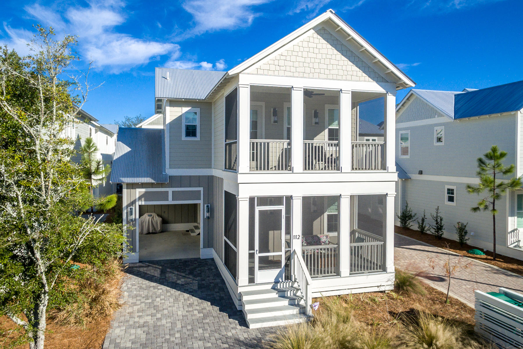 Located close to the award winning beaches of Grayton, this Dogwood floor plan features open concept living and dining, three spacious bedrooms each with en suite bathrooms, plus additional powder room on main floor. Rental projections are $64K, super rental! The chef's kitchen offers 42' wood shaker style cabinets with soft close doors and drawers, quartz countertops in kitchen, tile backsplash and stainless-steel appliances. For the investor, 3 owner's closets for storage!Superior construction includes, Jeld-Wen hurricane impact doors and windows, high speed structure wiring network, Taexx Pest Control, and Galvalume metal roofing. Enjoy outdoor living with 2 screened porches, providing an additional 304 SF to the 1919 heated/cooled SF. (Total of 2223 SF)
