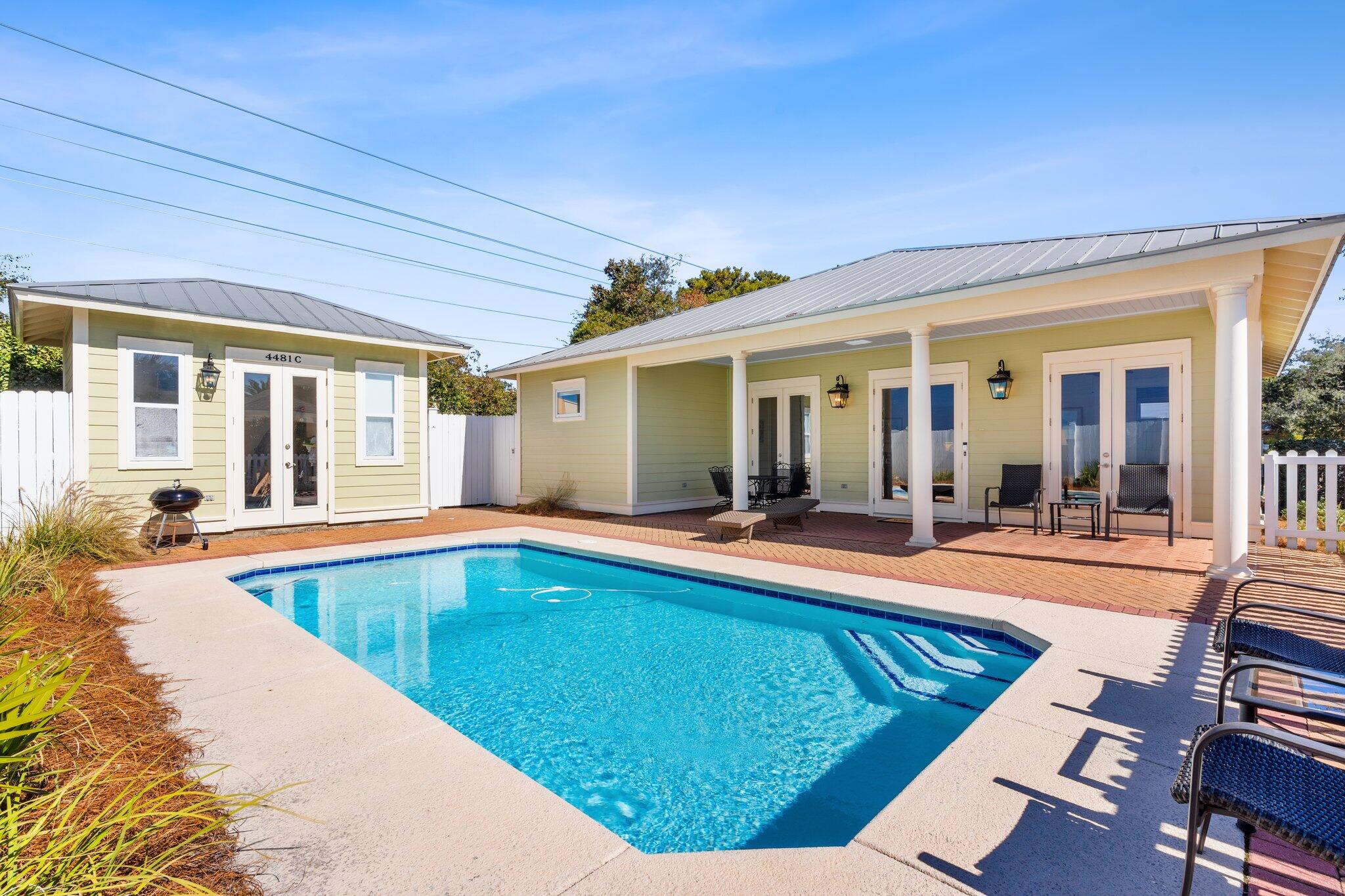 Located in the famous Crystal Beach neighborhood, this charming beach cottage known as the 'Greenhouse' offers the perfect blend of coastal living and modern convenience. Built in 2004 and meticulously maintained by its original owners, the home has seen several updates over the years, including fresh interior paint in 2024, a new pool pump in 2024, a hot water heater in 2020, exterior paint in 2019, and a replastered pool in 2015. The Greenhouse can sleep eight, and this property features a master bedroom with a private bathroom, complete with a standing shower. The full kitchen has granite countertops, ample cabinetry, and a breakfast bar beautifully accented with pendant lighting. The living room is filled with natural light and includes an electronic fireplace, creating a cozy atmosphere for relaxing evenings indoors. The open-concept layout is ideal for entertaining, seamlessly flowing outdoors through three sets of French doors that lead to the private pool area surrounded by a white picket fence. An additional highlight is the separate pool house which includes a half bath. For added convenience, the property also features an outdoor shower, perfect for rinsing off after a day at the pristine white sandy beaches that Destin is known for.
The nearest beach access is just blocks away, down at the end of Hutchinson Street. This home is in a serene setting with no high-rises in sight. Sold fully furnished, this property is an excellent opportunity for a vacation rental, secondary home, or even a primary residence. With its unbeatable location and thoughtful updates, this Crystal Beach gem is ready to be your perfect coastal retreat.