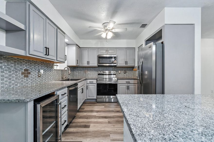This beautifully updated Crestview home offers the perfect combination of comfort, style, and functionality, set on an acre of land. Mature landscaping surrounds the property with a vibrant row of azalea bushes along the perimeter and a stately magnolia tree in the front yard, providing natural privacy and timeless curb appeal. Inside, durable vinyl plank flooring flows seamlessly throughout, complementing a fresh, neutral color palette that creates a warm and inviting backdrop for any decor. The thoughtful layout includes a spacious living room, a formal dining room and a bonus room right off the kitchen with its own mini-split HVAC system. It offers endless flexibility, easily serving as an office, home gym, craft space, or guest suite. The heated and cooled bonus room further extends the living space, offering an ideal spot to relax and enjoy backyard views! There is also an additional space off the living room with a murphy bed that could also accommodate guests or serve as a fourth bedroom. The kitchen is a true centerpiece, designed for both beauty and practicality. Featuring gleaming granite countertops, a large center island, a wine and beverage cooler, and ample cabinetry, this space is perfect for cooking, entertaining, or gathering with family and friends. Recently updated appliances, including a microwave, range, and dishwasher (all approximately one year old), add to the home's modern convenience. The primary suite offers a generous walk-in closet and a private bath with a stylish vanity and glass-enclosed tub/shower combination, while the second bathroom is equally updated with modern finishes. Custom barn doors add character and versatility to the interior, while updated lighting throughout enhances its inviting atmosphere. Recent improvements include brand-new windows in the main area of the home with a transferable 30-year warranty, fresh interior paint, and updated ductwork, ensuring comfort and efficiency for years to come. A durable metal roof and an assumable 5% FHA mortgage option for qualified buyers make this home a truly unique opportunity. Outdoors, the property continues to impress with a fully fenced backyard, a large open patio, a workshop with a 50-amp RV outlet and a storage shed. NO HOA and the chicken coop adds a touch of country living, making this an ideal property for those who enjoy sustainable lifestyles or hobby farming. The long driveway provides ample parking for multiple vehicles, RVs, or recreational equipment, and the home is already wired with a generator hookup and transfer switch for added peace of mind! Located just minutes from Crestview's shopping, dining, and schools, this home offers a rare combination of thoughtful design, practical amenities, and over $30,000 in recent upgrades. With its stunning kitchen, versatile spaces, and beautifully landscaped acre, this property is a must-see for buyers seeking both style and functionality. Schedule your showing today!

*Note: Some photos have been virtually staged*