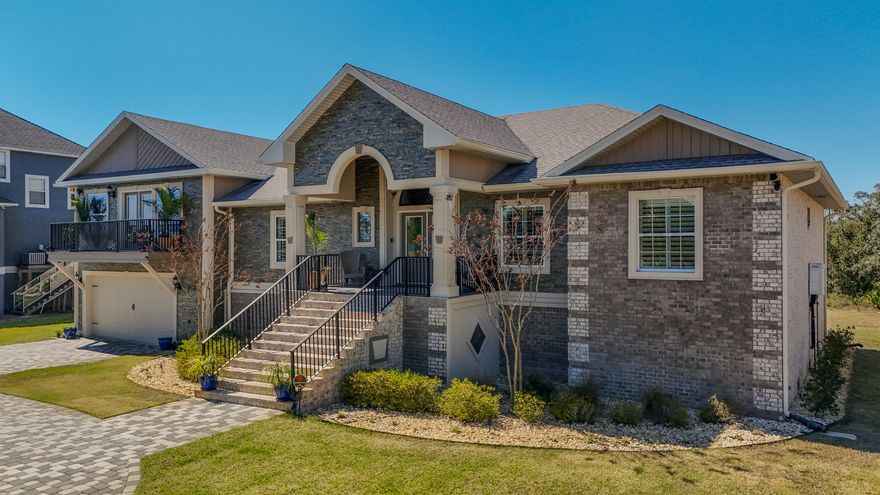 Custom Home with Breathtaking Water Views. This  5-bedroom, 4-bathroom home in the heart of Navarre is a must-see! Offering unparalleled views of the Sound and Intercoastal Waterway, this meticulously maintained property is truly one of a kind. Highlights include: Two primary suites for ultimate comfort & privacy. Gourmet kitchen with natural stone countertops including over-sized island, pot filler, and custom details. Multiple balconies showcasing breathtaking waterfront views. Custom craftsmanship in every inch of the home. Inviting front porch with a wood ceiling & elegant stone paver driveway. Don't miss the opportunity to own this exquisite home that checks all the boxes! Floor plan & full features list in the photos. One mile to Navarre Bridge and the double boat ramp at Juana's.