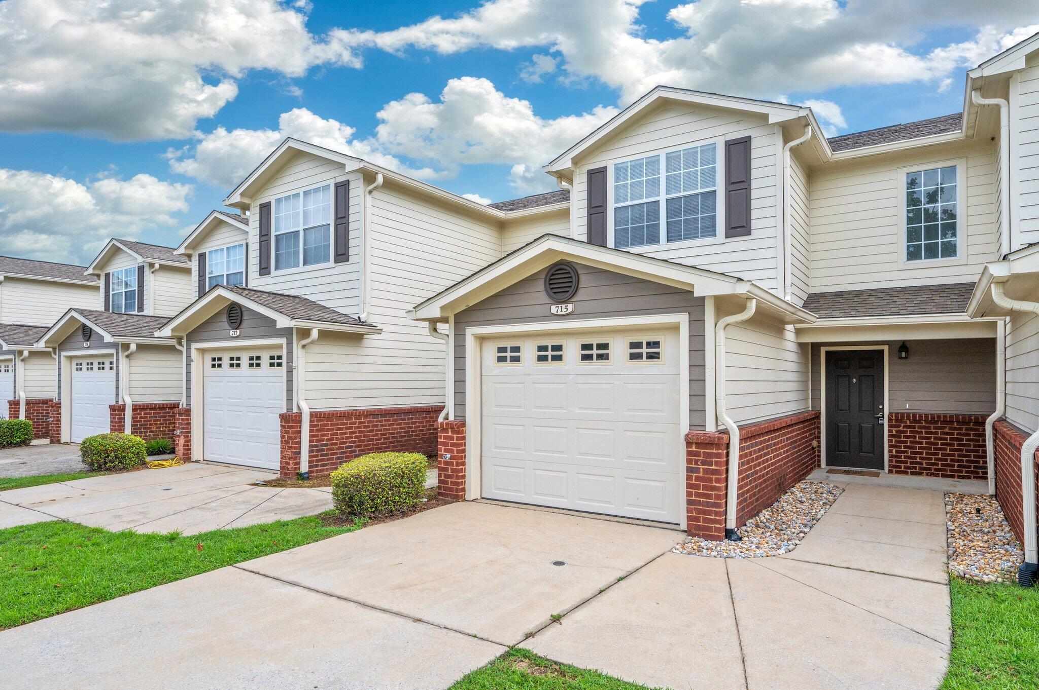 Welcome to this charming two-bedroom, two-and-a-half bath townhome located in the heart of Crestview. The main level features durable ceramic tile flooring throughout, a convenient half bath, laundry room and a functional galley kitchen with maple cabinetry and a peek-through window that opens to the combined living and dining area--perfect for entertaining. French doors lead to a landscaped backyard with a peaceful view of the pond. Upstairs, both bedrooms offer private en suite bathrooms with bath-shower combos, spacious vanities, and walk-n closets with newer carpet. This charming townhome also includes a one-car garage for added storage and security. This well-maintained community offers fantastic amenities, including a swimming pool, clubhouse, and playground ideal for enjoying Florida living at its finest!