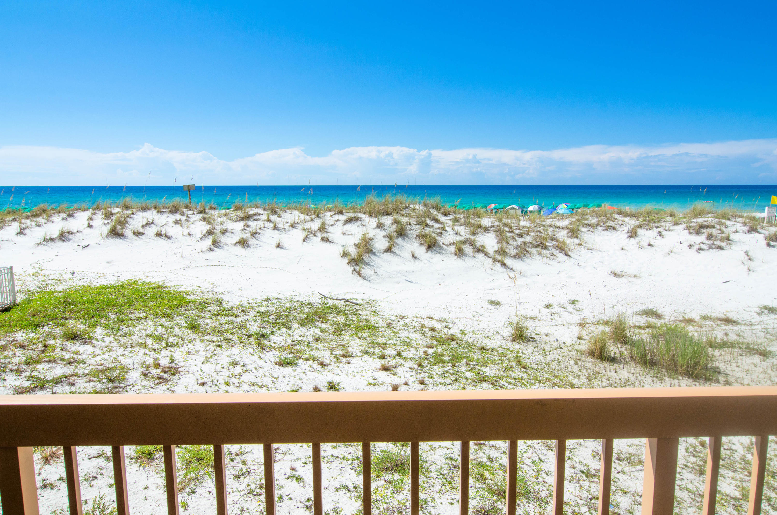 Rental powerhouse in the popular Pelican Beach Resort with a toes-in-the-sand GULF FRONT location on the famed beaches of Destin. Revel in this spacious and fully furnished condo with panoramic views of the Gulf from your balcony and living room with a great first floor location so no waiting on busy elevators! Decorated with the beach and sun in mind, this condo features: tile floors throughout the main living areas, a king sized Master Suite with its own private bathroom and hallway bunks plus full sized guest bathroom. Easily sleeps 6 with sofa sleeper! Centrally located to all the dining and entertainment Destin is famous for including spas, shopping, golf, fishing and more. Pelican Beach has amazing resort style amenities, including: three swimming pools (one indoor), tennis,