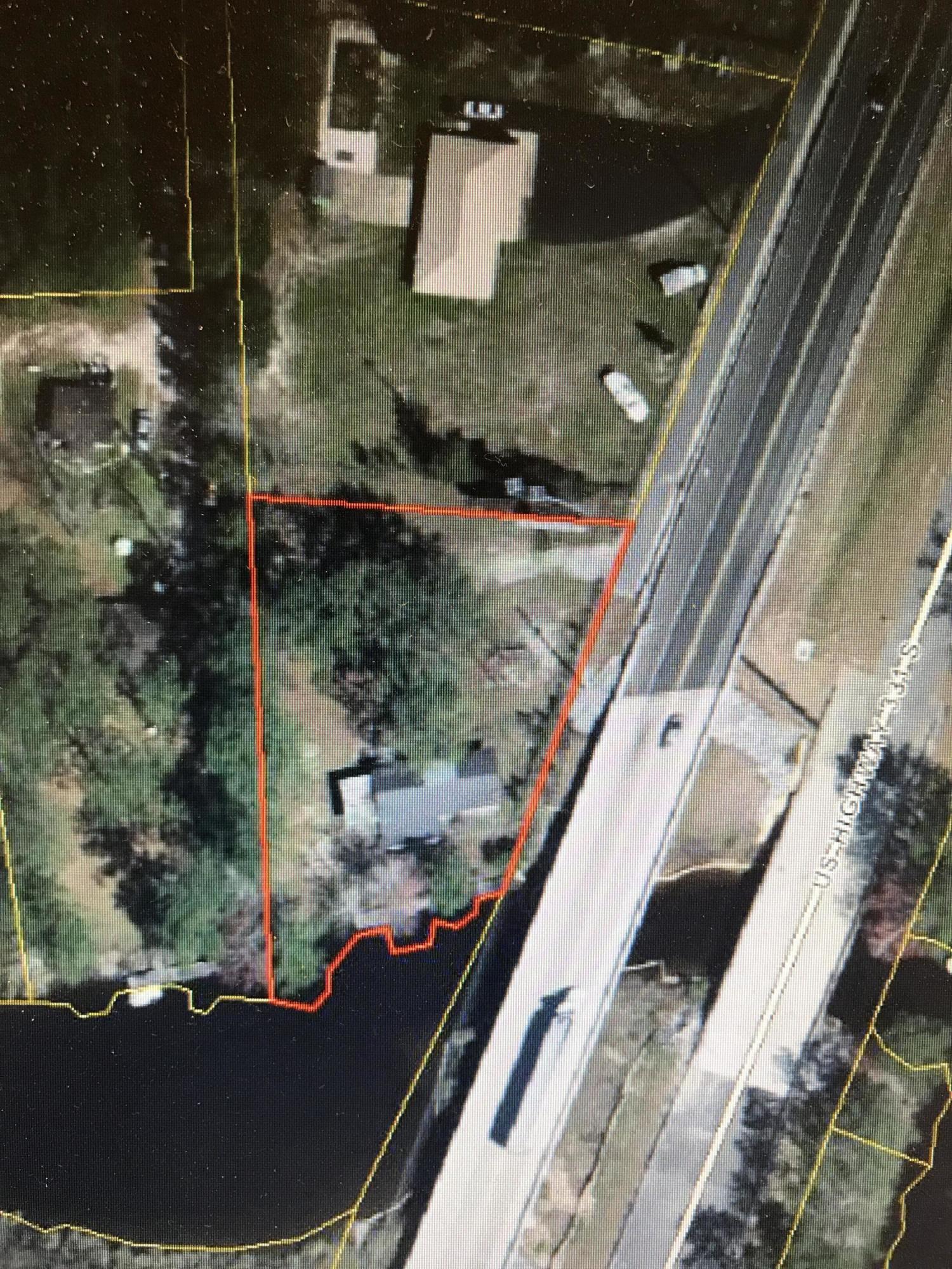 Great waterfront commercial space ready for new owner. This property has a large amount of waterfront on deep water with docks and boat ramp. The building is a little over 1000 square feet and has bathroom and office. The property has a large sign leased and makes $200 month. Has been a working marina for years. Could be used for office, marina, boat storage or county would allow residential here. Definitely priced to move!!!