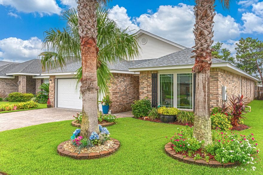 From the moment you enter this beautiful home you'll notice the many quality upgrades and thoughtful details that have been added to enhance the value and ambiance that sets it apart from the rest! Located just yards from the sugar white sands of the Emerald Coast, the community of Paradise Retreat offers 320 feet of deeded beach access for the enjoyment of its residents and guests. Your options are limitless with opportunities to use this piece of paradise as your primary home, secondary home or an income producing property via long or short term rentals. The home has been meticulously maintained and pride of ownership is evident. You'll notice curb appeal galore from the beautiful tropical landscaping and sod (2017), new roof (2023) new front and back doors (2024), brick paver driveway and front entrance (2016) and an expanded back patio in the fully fenced backyard. New high impact casement windows were installed in 2019. Casement windows are hinged on the side and crank outward to open like a door. Let that fresh air in with ease. No more struggling to open a double hung window! Never run out of hot water for yourself or your guests with a Rinnai tankless hot water heater (2018)  A new HVAC system was installed in 2018 as well. Thoughtful upgrades were also added to the interior including crown molding throughout the home, stacked stone accents in the living room and dining room, a beautiful new tile shower and whirlpool tub in the master bedroom, new tile shower in the guest bathroom, new ceiling fans in the living room and guest bedroom, new stainless electric range and refrigerator (ice maker is not warranted) in the kitchen (2016) as well as tile backsplash and accents as well as fresh paint in many of the rooms. Paradise Retreat is uniquely situated directly between Highway 98 and Scenic Gulf Dr, which provides both north and south entrances/exit for the community. Come take a look at this one of a kind property that checks all the boxes!