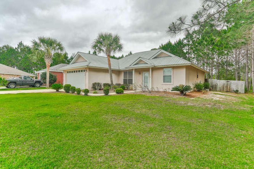 This Will Not Last Long! Fabulous 3 Bedroom/2 Bath Ranch Home, located in Emerald Walk on 30A in a Cul-de-sac lot! Neighborhood Entrance is right off Scenic Hwy 30A! This lot is one of the largest lots in the neighborhood! This property has been upgraded with New Kitchen Granite and New laminate flooring in the 2nd & 3rd bedrooms! The kitchen has a large breakfast bar, formal and informal dining areas, large great room, Master Suite with hardwood flooring and master bath with upgraded walk-in shower and custom built-in shelving in the master walk-in closet, fabulous screened-in patio, large fenced backyard backs to the preserve, and a two-car garage! Available to start showing Wednesday April 26th! New Pictures coming soon!