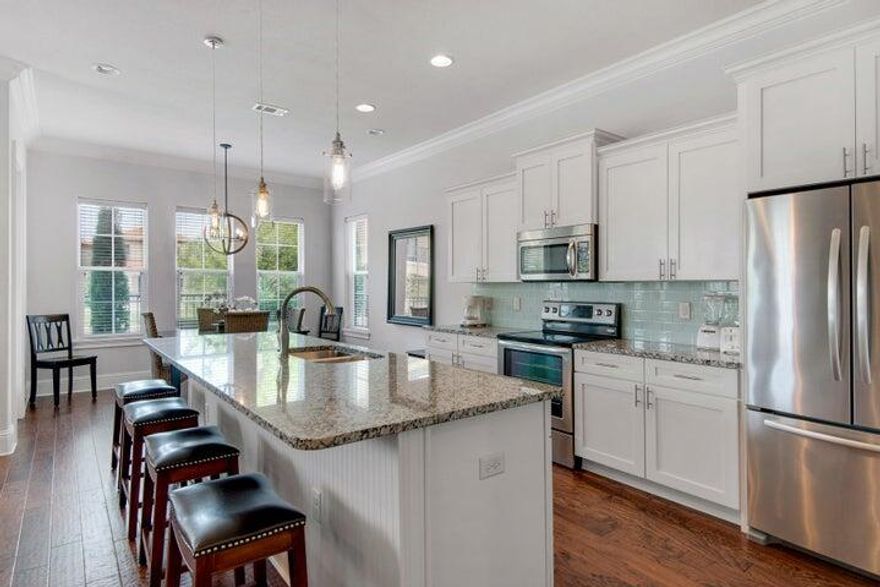 **PROFESSIONAL PHOTOS COMING SOON**. Welcome to 1964 Baytowne Loop, a rare opportunity to own a 4-bedroom, 4-bathroom home designed for comfort, flexibility, and effortless ownership. The open-concept floor plan is highlighted by hardwood flooring, granite countertops, and KitchenAid appliances, creating a clean, timeless coastal aesthetic. A main-level bedroom adds everyday convenience, while the remaining bedrooms offer privacy and space for family and guests. The living spaces flow seamlessly into a screened-in patio, creating a private outdoor retreat ideal for morning coffee, evening cocktails, or unwinding after a day at the beach. The attached garage provides valuable storage--perfect for beach gear, bikes, owner belongings, or golf cart storage. What truly makes this home special is its location inside Sandestin Golf & Beach Resort. You're wrapped in 2,400 acres of 4-championship golf courses, a full serve marina, tennis center, miles of walking and biking trails, dining, shopping, and the freedom of golf-cart living.