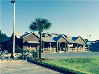Turn-Key'' restaurant opportunity in Panama City Beach, Florida. Currently ''Dirty Dick's Steak House''. +/-9,300 square feet. Quality construction with concrete block walls, cedar-shake siding, standing seam metal roof, etc. The sale price includes all furnishings, fixtures and equipment including a state-of-the-art Brazilian-style salad bar with cooled granite counter-top and a beautiful black onyx backsplash. We can provide the lengthy list of FF&E to be included in the sale upon request. Located in the heart of Panama City Beach, with a high profile, high traffic location adjacent to Wonder Works (the upside down building)and across the street from Ripley's and east of the intersection of Hutchison Blvd at Super Wal-Mart.