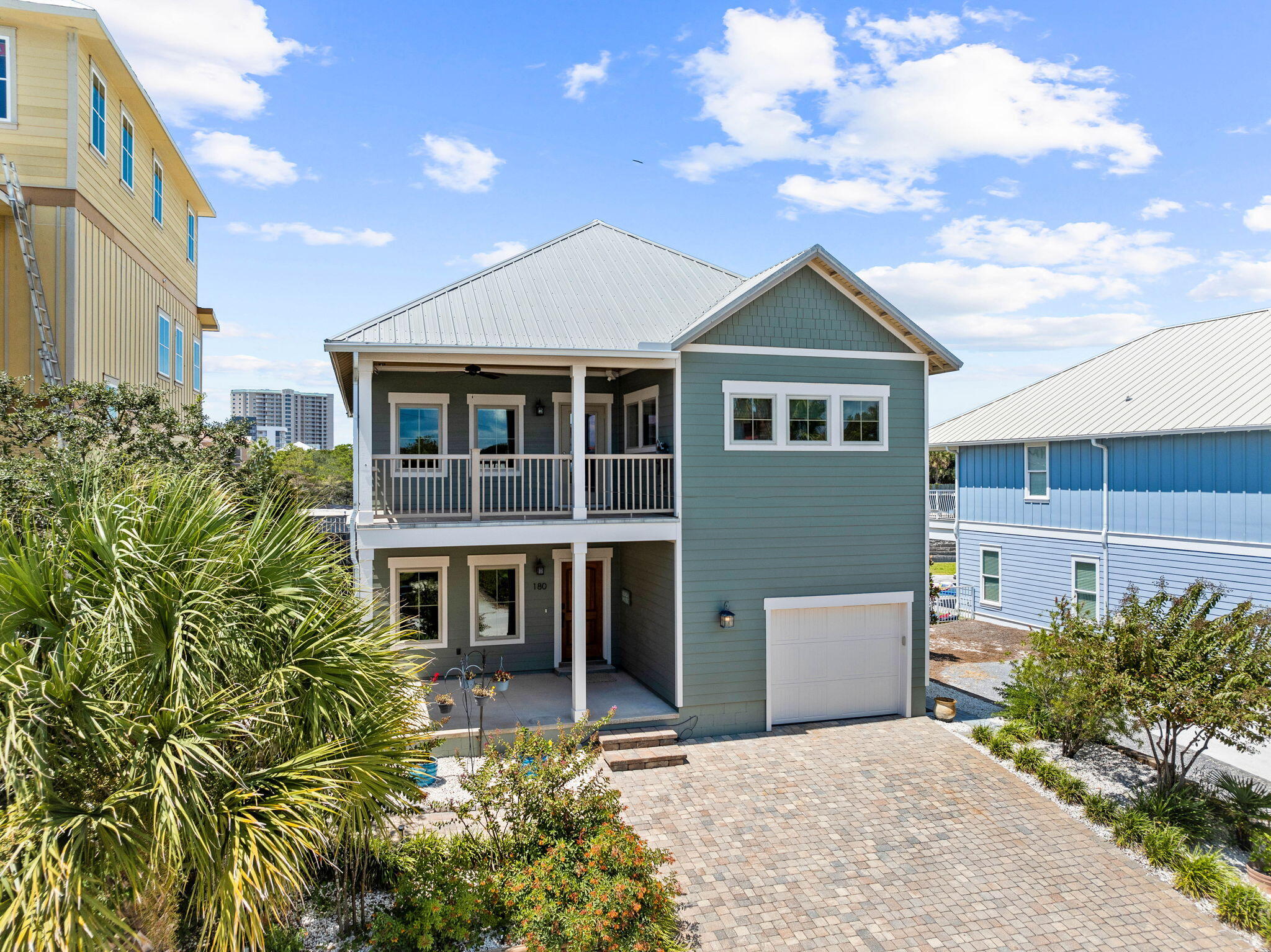 Experience the pinnacle of coastal living in this stunning 3-bedroom, 3.5-bathroom home located in the prestigious Tang-O-Mar community. Perfect as a primary residence, vacation home, or rental property, this exceptional residence offers exclusive deeded private beach access just 800 feet away, reserved for HOA members.Spanning 2,512 sq ft of refined living space, this craftsman-style property combines quality and comfort with breathtaking Gulf views. In addition to the 2,512 square feet, there is a climate-controlled bonus room off of the garage that could be used as a bunk room and a large climate-controlled attic with easy access, perfect for extra storage or as an incredible owners closet.   By maximizing this additional space, the home could sleep as many as 12 guests The main house and guest house provide an ideal retreat with a thoughtfully designed layout and upscale amenities. Enjoy sunny days in the backyard oasis featuring a beautifully crafted carriage house and a sparkling pool/spa area, all enclosed within a private fenced yard for your enjoyment.

The main living area showcases the charm of cypress ship-lap walls and ceilings, complemented by wood-cased windows and doors that highlight timeless craftsmanship. Natural light enhances the warmth of the white oak flooring. For those who love to cook, the gourmet kitchen is equipped with top-of-the-line Wolf and KitchenAid appliances, solid wood cabinets, and elegant granite countertops, accented by a custom-tiled backsplash that brings a touch of the beach indoors. The two spacious bedrooms in the main house offer ample closet space and adjoining bathrooms fitted with high-end fixtures. An outdoor balcony extends the living area, creating a seamless indoor-outdoor experience. Built-in features throughout the home add convenience and organization, while the lower level offers a private living space perfect for guests or a serene retreat. The lower level's stained concrete floors combine style and durability for easy maintenance.

Step outside to unwind in the heated pool and hot tub, featuring a PebbleTec finish and surrounded by Shell Reef coping, porcelain pavers, and pebble stones. The WearDeck pool deck is both durable and ideal for entertaining. The carriage house Interior and exteriors are finished with Boral ship-lap siding and main house is wrapped in Hardie board siding with Miratek trim, freshly repainted in 2023. Inside the carriage house, modern comforts abound with high-end utilities and appliances. The tri-fold glass Euro doors merge indoor and outdoor living, revealing a spacious room with a full bathroom and an outward-facing wet bar with a marble slab countertop. The KitchenAid counter-height refrigerator, freezer, and ice maker make this area perfect for gatherings. A hurricane-rated Janus Model 750 roll-down door adds protection from the elements, while an electrical storage closet and Bryant Evolution Ductless Mini Split system ensure comfort year-round.

Enhance your outdoor experience with a natural gas connection for an outdoor grill, complete with a built-in grill awning. Additional upgrades include an elevator, a two-car garage with golf cart parking, and a pavered driveway with space for five cars.

For energy efficiency and storm protection, the home features impact windows and doors with Low-e glass, cell foam insulation in the attic and walls, and a threaded rod wind hold-down system. A whole-house automatic generator powered by natural gas ensures uninterrupted comfort, while the Rinnai tankless hot water system and Pex/Maniblock system provide endless hot water. The pressure-treated KDAT exposed eaves promise lasting beauty, and the property's elevation at 21 feet above sea level offers added peace of mind. A golf cart is included with the property, completing this exceptional coastal retreat.

