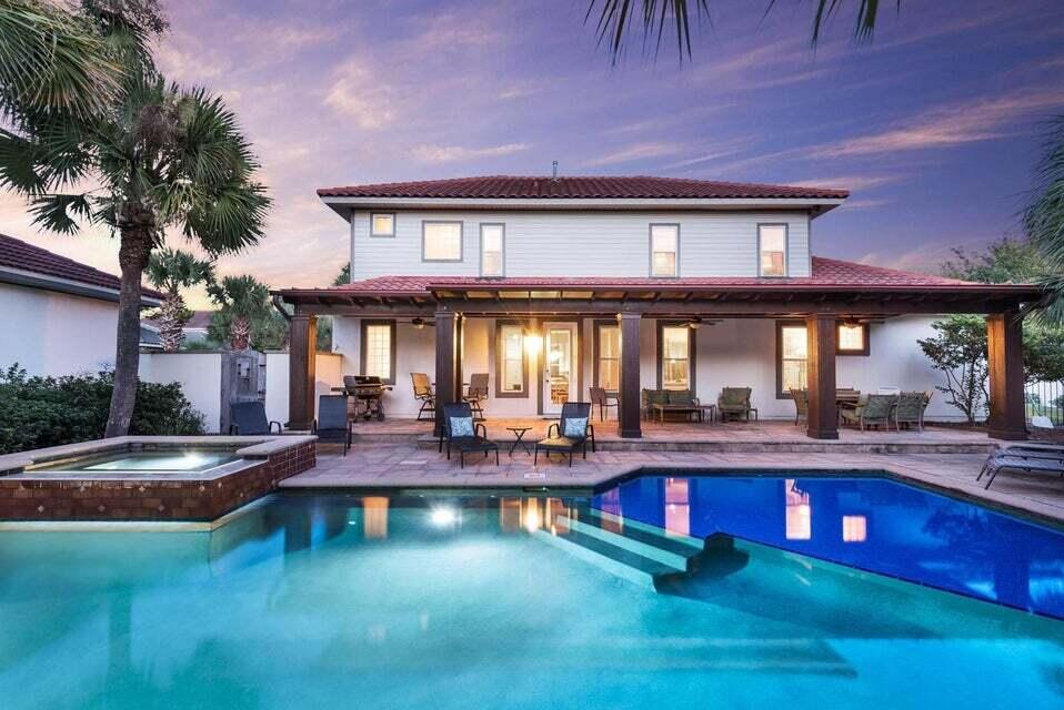 WOW! What an incredible Rental Investment. Lee's Retreat Grossed $151,890 in 2021 and $201,738 in 2022. Lee's Retreat is a spectacular custom home with many, many extra features such as a large gourmet kitchen with large island, elegant PRIVATE POOL & SPA, large private courtyard with waterfall, plenty of outdoor dining, multiple master bedrooms (1 on the first floor and 1 on the second floor), beautifully furnished and 2, 6 seat street legal GOLF CARTS convey with this wonderful home! Fantastic! Walk into this one of a kind home and let your breath be taken away! The Stressed Wood beams that accent the ceiling are only one of the many upgrades! Don't forget your quick access to Club Destiny, the resort style pool complex featuring a 3000 sq ft pool/spa, children's playground,