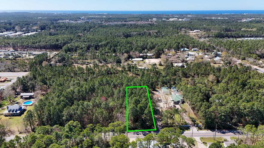 Large lot in the heart of Santa Rosa Beach. 10 min drive to shopping, restaurants, beach. Back yard privacy due to protected wetlands in back yard.  Permits are in place  wetland study, clear, fill permit come with this lot.  This saves about a year time.