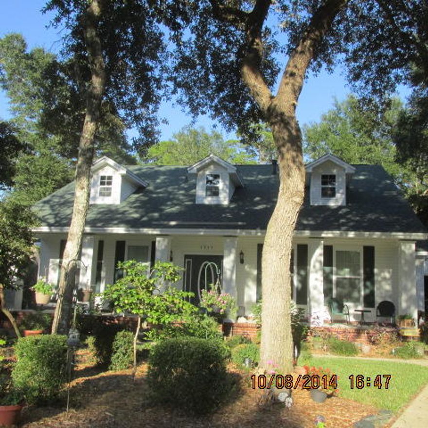 This home sits on one of the largest lots in Village of Bolton, cul de sac and backs to Eglin Federal Land. Walk in being welcomed by leaded glass front door with sidelights a wow two story foyer. Randy Wise custom built home with all the trim modeled by a home built at the turn of the century, tall baseboards, all doorways and windows trimmed,crown mold, yet all the modern conveniences. The kitchen was remodeled in 2008, so all kitchen appliances replaced at that time. All of the lighting fixtures fans, door hardware and exterior doors have been replaced. Bathroom plumbing fixtures replace. Roof replaced in 2005. The home has a freestanding wood burning stove sitting on an old Chicago brick hearth with brick mantle. Master bdroom and one more bedroom down stairs with two full baths.