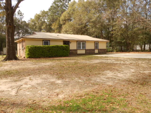 This Property is located in Oakdale Mini Farms of Crestview, Florida between Famer St and Valley Rd, very near all the shopping areas around Stillwell Blvd. Please note from the pictures that the Kenmore stove/oven, Samsung refrigerator, Maytag washer and Maytag Dryer all convey with this transaction, they are all fairly new. The various window treatments will convey with the sell, and the windows are all double pane with no fogging at all. The metal roof was installed about 6 years ago, so it is relatively new. Also the A/C is only about 5 years old. More, the back yard has a complete chain linked fence around it and features three structures that will convey with the sell. There is a workshop (12X24) that has electricity; a storage building (12X24); and a carport (20x20)