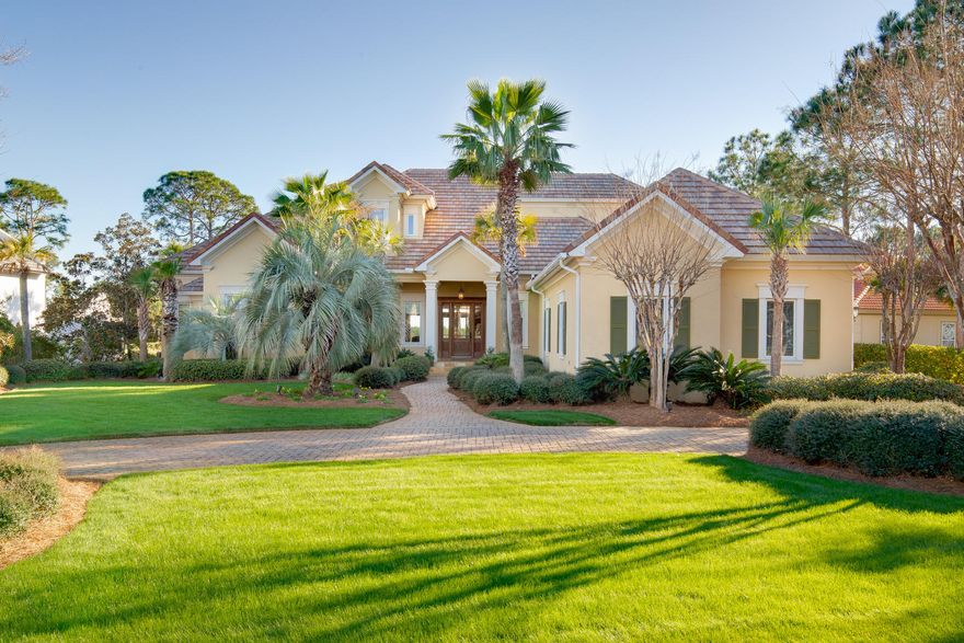 Located on Burnt Pine's most prestigious street, this custom 4,626 square foot residence enjoys far-reaching golf and water views within the exclusive Sandestin Golf and Beach Resort. This designer home is brimming with outstanding custom features and has a dedicated area for every activity. Along with a capacious master suite and a large office on the main floor, it boasts two additional guest suites on the second floor plus a bonus room/fourth bedroom and a fitness room. The master suite has a stunning wood and quartz bathroom with garden tub, palatial mirror features and twin walk-in closets with a range of built-ins. Laundry rooms are conveniently located on both levels and there's an additional room over the garage with bays for two vehicles and a golf cart. The gourmet kitchen is worthy of a feature in any upscale magazine with its natural stone backsplash inset with copper Celtic knots. Custom-built cabinets are beautifully finished with iron hardware. Lit by Italian glass pendant lights, the extended granite-topped breakfast bar is the perfect place to sit for breakfast and appreciate every fine detail. End the day with friends, serving cocktails at the adjoining wine bar. Put your feet up in the inviting screened lanai with fireplace, tile floors and outdoor kitchen. The adjoining elevated patio with elegant fountain is tailor-made for entertaining and there's room to add a private pool. Enjoy the coastal living at its finest in the Sandestin Resort - a 2,400-acre resort with beautiful white sand beaches, four championship golf courses, a world class tennis complex, a 113 slip marina, and the pedestrian Village of Baytowne Wharf and Grand Boulevard with full range of shopping, amenities, and dining.