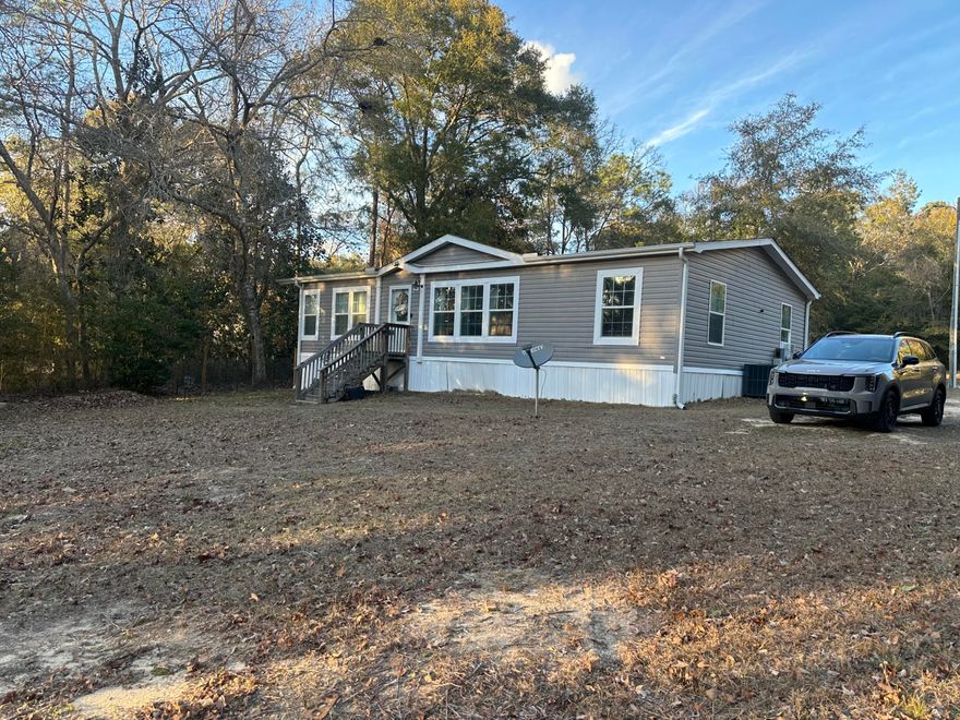 Have you been looking for a quite get away on the lake? Well, this might be the property for you. This beautiful, manufactured home located just north of DeFuniak Springs on Lake Holley. The home is 3/2 and features a large living room area, perfect for entertaining guest. The HVAC was recently replaced and is less than a year old. The best part of this property is the gorgeous view of the lake. With approx. 85-100 feet of lake frontage featuring a private boat launch you are ready to hit the water for some prime fishing opportunities. The property is 1 acre in size and features a shed with electric and water already hooked up. This well-maintained home is move in ready and comes with washer, refrigerator, stove/oven, and dishwasher. Come take a look and see if this home is right for you!