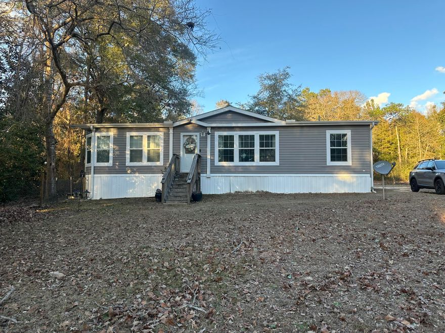 Have you been looking for a quiet get away on the lake? Well, this might be the property for you. This beautiful, manufactured home located just north of DeFuniak Springs on Kings Lake. The home is 3/2 and features a large living room area, perfect for entertaining guest. The HVAC was recently replaced and is less than a year old. The best part of this property is the gorgeous view of the lake. With approx. 85-100 feet of lake frontage featuring a private boat launch you are ready to hit the water for some prime fishing opportunities. The property is 1 acre in size and features a shed with electric and water already hooked up. This well-maintained home is move in ready and comes with refrigerator, stove/oven, and dishwasher. Come take a look and see if this home is right for you!