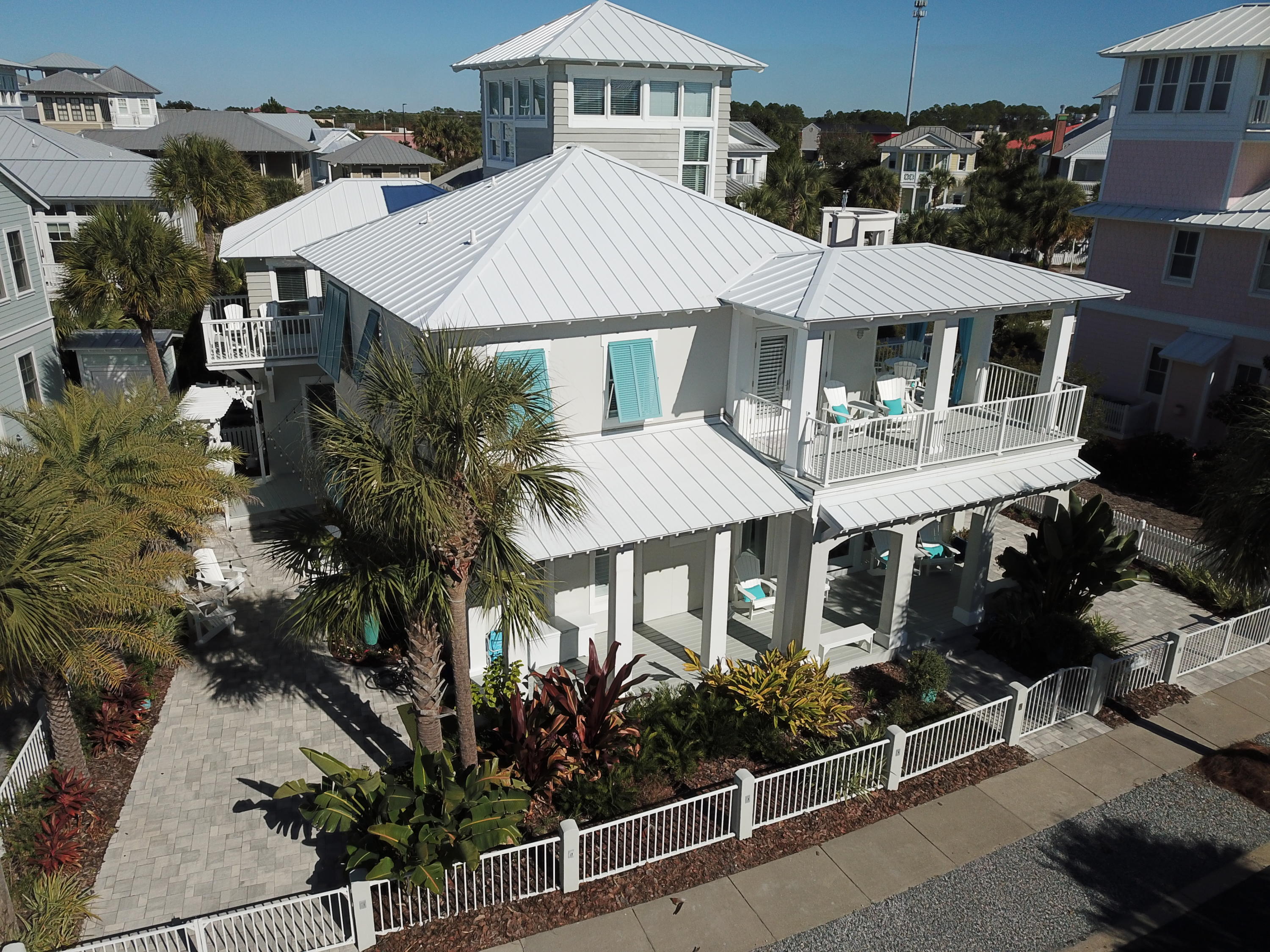 Contemporary decor meets coastal design in this completely renovated home located steps from the beach. Private pool, porches and outdoor kitchen provide spaces that everyone can enjoy. Renovation was completed in 2018 and includes redesigned kitchen with Viking appliances & quartz countertops, updated custom bathrooms, custom boat bunks, & other must see updates. Main house has 4 King ensuites and bunk room. Carriage house has 2 bedrooms and 2,5 bathrooms. Landscape features uplighting, Sylvester palms, cafe' lighting and fountain. The new saltwater pool has Laminar jets & lighting with a Heat Pump to heat & cool the water.Located in the gated community of Carillon Beach where the wide expansive beach has 8 walkovers, beach front pool, 2 other community pools and a lake to enjoy