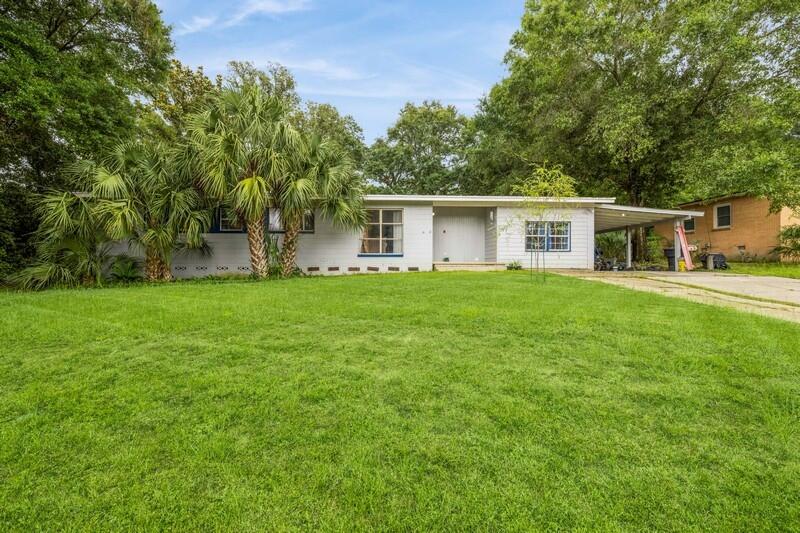 This 3BR/2BA home offers approximately 1,900 square feet with a layout that balances open living areas and private bedrooms. Inside, you'll find a practical layout and a bonus room that leads to the Florida room.Outside the covered deck steps down to a paver-lined yard with a built-in fire pit and ambient lighting, creating a cozy spot for evening gatherings. The elevated lot also includes a powered workshop and a separate storage shed.While the home could use some updates-perfect for a handyman- it has a solid structure and great potential. Seller is offering a new roof with an acceptable offer. Home is priced well below comps. Home is near Cordova Mall, Sacred Heart/Ascension, a few miles from NAS Pensacola, 3 miles from the airport and many restaurants.