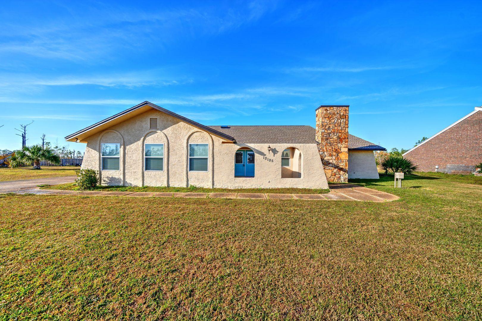 Beautiful 3 bed, 2 bath Mediterranean inspired stucco home in the Sandy Creek Ranch and Country Club community. This home boasts a grand entrance with a courtyard and bull-nose archways. The welcoming foyer leads to an open living room, dining area and kitchen floor plan. The kitchen is equipped with double ovens, a wet bar w/ mini fridge, breakfast bar and a large pantry for extra storage. There is a half-bath off the living area for the ultimate convenience. The master bedroom is very spacious and has a walk-in closet. The private master ensuite features a double vanity, surround-tile shower and a private toilet room. The two guest bedrooms have new carpet and share a Jack-n-Jill bathroom. Heated and cooled sunroom off the living area is the perfect spot to enjoy evenings with family