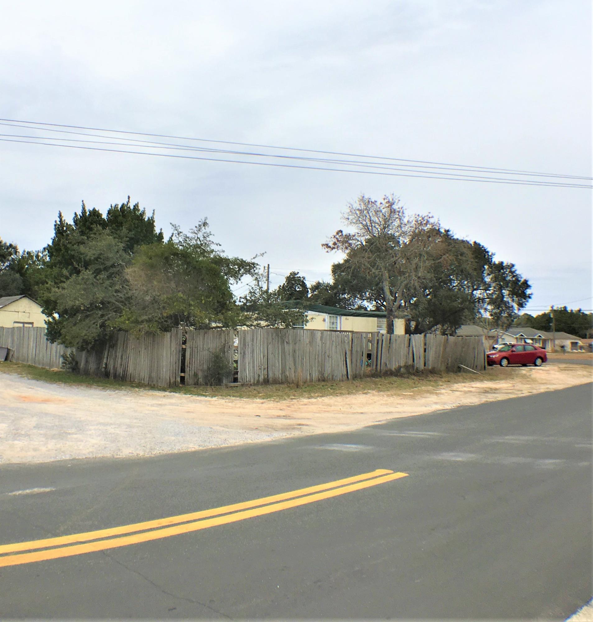 ENDLESS POSSIBILITIES ! Calling all builders or investors. Check out this Multi-use property zoned R-2 just 6.5 miles from Hurlburt AFB. Six Impact Fees/Tap fees have already been paid for. Build multiple single family homes, multiple townhomes or develop this into a nice trailer park. Comprised of three lots that are currently leased by one trailers for $300.00 per month. Seller does own one of the trailers that has been on the property for many years. Seller is willing to do owner financing. Call today for more information and drive by the property to check it out.