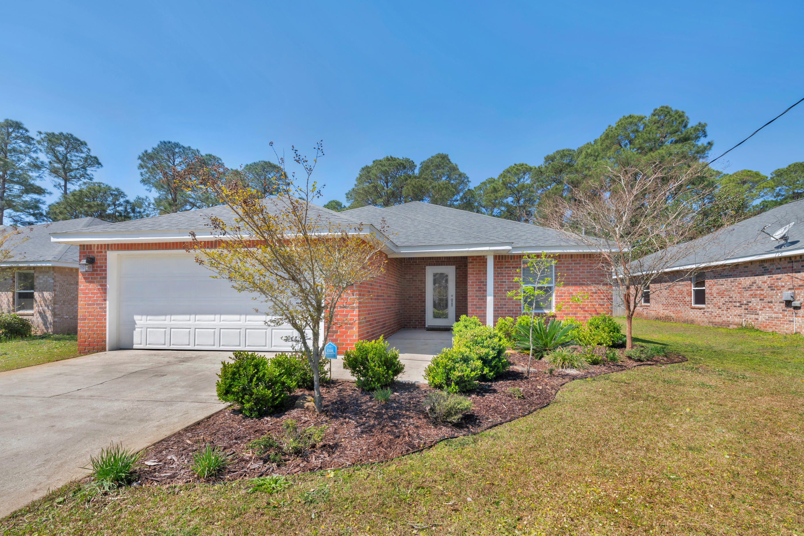 Beautiful home nearly new construction (2013) available now! This 4 bedroom 2 bath home with a 2 car garage is located on a quiet cul-de-sac in Mary Esther minutes from Hurlburt Field, popular Navarre & Fort Walton Beach Beaches, Shopping & Dining! This open design concept offers Pergo Wood & Modern Tile throughout the home, granite kitchen with designer cabinets, separate pantry, breakfast bar and stainless steel appliances. The spacious master suite offers a walk in closet & a double granite vanity in the master bath. This home has spacious bedrooms, a lovely laundry room & tons of storage! Take a look at this back yard space, fully fenced in and backs up to the reserve. Call today and you can start enjoying your summer evenings on this screened porch!