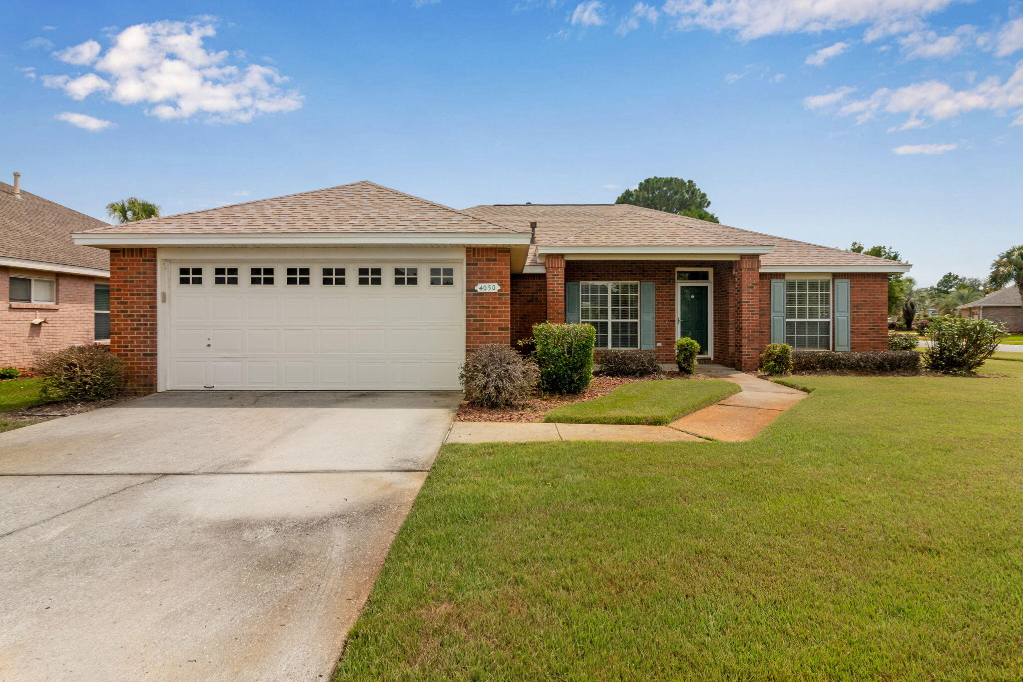This all brick home located in the heart of Destin is situated on a large corner lot is located just 1 mile from our white sandy beaches, next door to the dog park, Morgan's Sports Complex, wal-mart, convenient to schools, shopping and dining. Enjoy your mornings while sitting in the screened veranda overlooking your fenced in backyard or sitting in the living room with an easy gas/electric switch roaring fire on those chilly days. This home features an open floor plan with carpet in the master bedroom and wide plank luxury vinyl in the living area, guest bedrooms and two full baths.