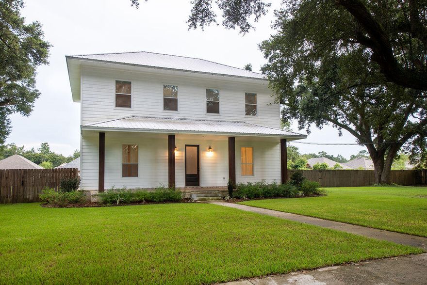 Southern charm farmhouse meets luxury and privacy on this 1.2 acre home adorned with mature oaks and a front porch that many could only dream of! Shiplap, rustic finishes, hardwood and travertine tile flooring are just some the delightful features awaiting you! Come on in and you are greeted with a generously sized living room featuring custom entertainment built in, tall ceilings and wood flooring. Kitchen features tons of granite counter space, stainless steel appliance an eat up breakfast bar and is open with the dining area. Your mater retreat is perfectly sized boasting a stunning en suite complete with tile shower, large soaking tub, double vanities and the farmhouse touch barn door. WOW, don't miss the custom closet/additional storage space in the loft!