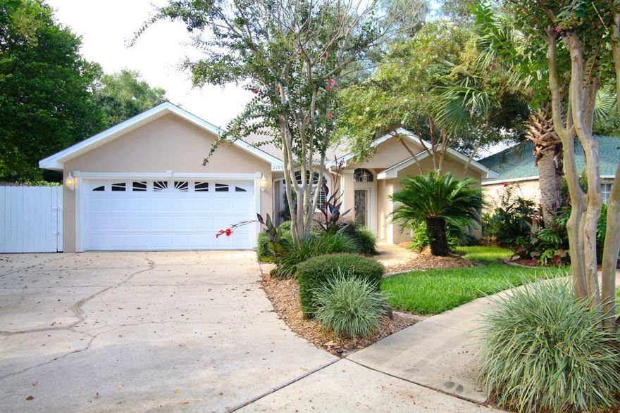 Immaculate home that is perfect for someone wanting peace, quiet, beauty, and convenience. With a 2-car garage, and open and airy interior, this centrally located gem is in a quiet cul-de-sac: there is only one way in/out of the neighborhood. The yard is charming and low maintenance, beautifully and professionally landscaped with tropical plants, and includes a sprinkler system. The back yard is very private, with a high fence, picnic area, and lush landscaping. Side yard has concrete parking pad that will accommodate 3 vehicles or a boat. New updates can be found throughout the home including carpeting, appliances, paint, and cabinets. The home has high ceilings, crown molding, large windows with plantation shutters throughout, and a lot of natural light.