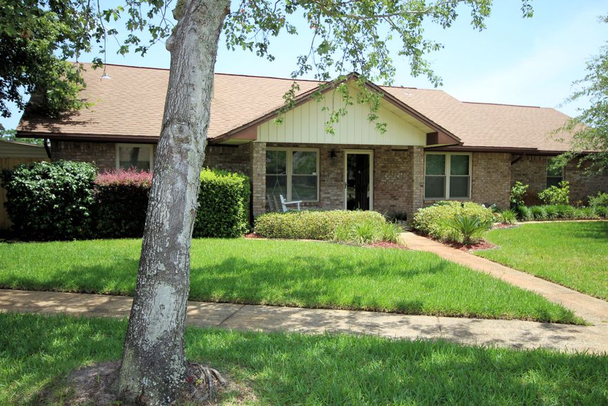 EXCEPTIONAL OFFERING! This is a One Owner Custom Built Home Maintained with Love! Located on a Beautiful Corner Lot in a Quaint Sidewalk Community Situated Between Ft Walton Beach and Navarre. Convenient to Hurlburt Field! This Home has had Numerous Upgrades over the Years. Kitchen Boasts Stainless Appliances and SileStone Counters. TWO LIVING AREAS. Enter from the Covered Front Porch into the Living Room with Gas Log Brick Fireplace. Living Rm Opens to Dining Rm with Custom Buffet and Glass Front Cabinets. Room Addition is a Perfect Place to Gather and Relax. Master Suite with Bathroom Remodel and Enlarged Walk-In Closet. Split Plan. Covered Back Patio. Yard is a Gardener's Paradise. Fully Fenced. Home Warranty Provided!This is a Beautiful One-of-a-Kind Opportunity!PLEASE SEE MORE!