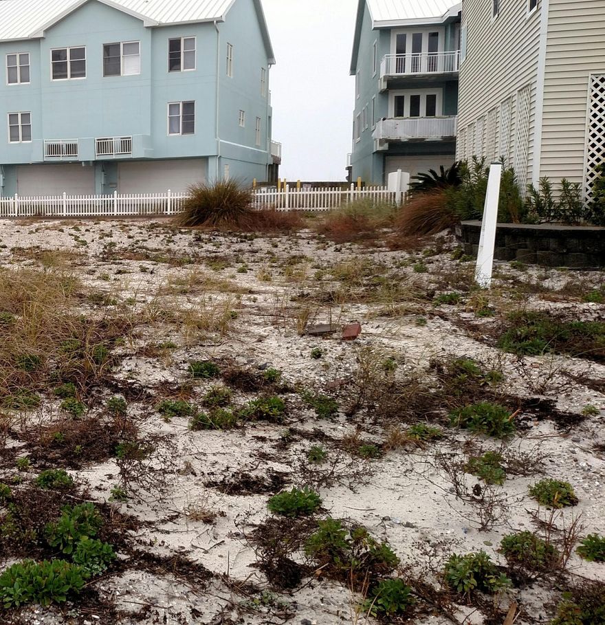 YES!! This lot is finally for SALE...One of the last few lots left situated between the Gulf of Mexico and Little Sabine Bay,literally steps from the beach!Build your very own cottage using your plans or use plans exclusive to the White Sands Subdivision.This property is located between the Protected National Preserve and the County owned Parks,which means NO COMMERCIAL DEVELOPMENT to interrupt the beauty of this absolute beautiful and peaceful area.If you have been looking for ''THE'' place to build your beach home, here it is! Minutes from great shopping and restaurants and yet quite and private at the same time. You have to see this lot and where its situated to grasp the undeniable desirability.This is the first time this property has been offered for sale in over 14 years!