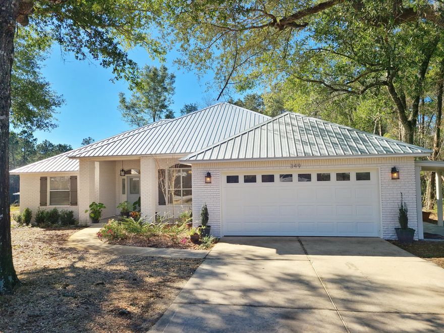 Over 2800sf under roof of this recently remodeled home located on the canal in Point Washington, with access to the Bay by boat. It's common to see 21 ft flats and pontoon boats parked in boat lifts at the canal front lots. This home with cathedral ceiling was recently remodeled and freshly painted, with new metal roof added in 2021. Carport on side for LSV (low speed vehicle).  New landscaping in the works currently. From the kitchen, connect with friends and family with seating for seven surrounding the kitchen. LG and GE kitchen appliances, 42'' deep one-level counters, with painted cabinets. Add a breakfast table or small office desk beside the slide out doors to the patio overlooking the back yard. You have to see this one in person! Schedule appt today.