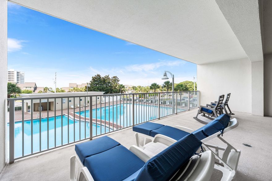 The oversized balcony overlooking the large pool is a favorite feature of the Seller, because they can easily check on friends or family swimming while kicking back nearby. Truly outside living at its best! Ask me about the ASSUMABLE VA LOAN with a LOW INTEREST RATE!  Ariel DunesII is a popular choice of many when looking to rent for a week or stay a lifetime enjoying the Coastal Lifestyle. Come take a look at this fully furnished, 2 bedroom/2 bath  condo, just steps away from the famous white sand beaches.  Also included will be access to 7 pools throughout Seascape, pickleball courts, tennis courts, golf course, playground and basketball court. The location is ideal, located near fun restaurants, grocery stores, shopping and lots of fun amenities available throughout the Emerald Coast.