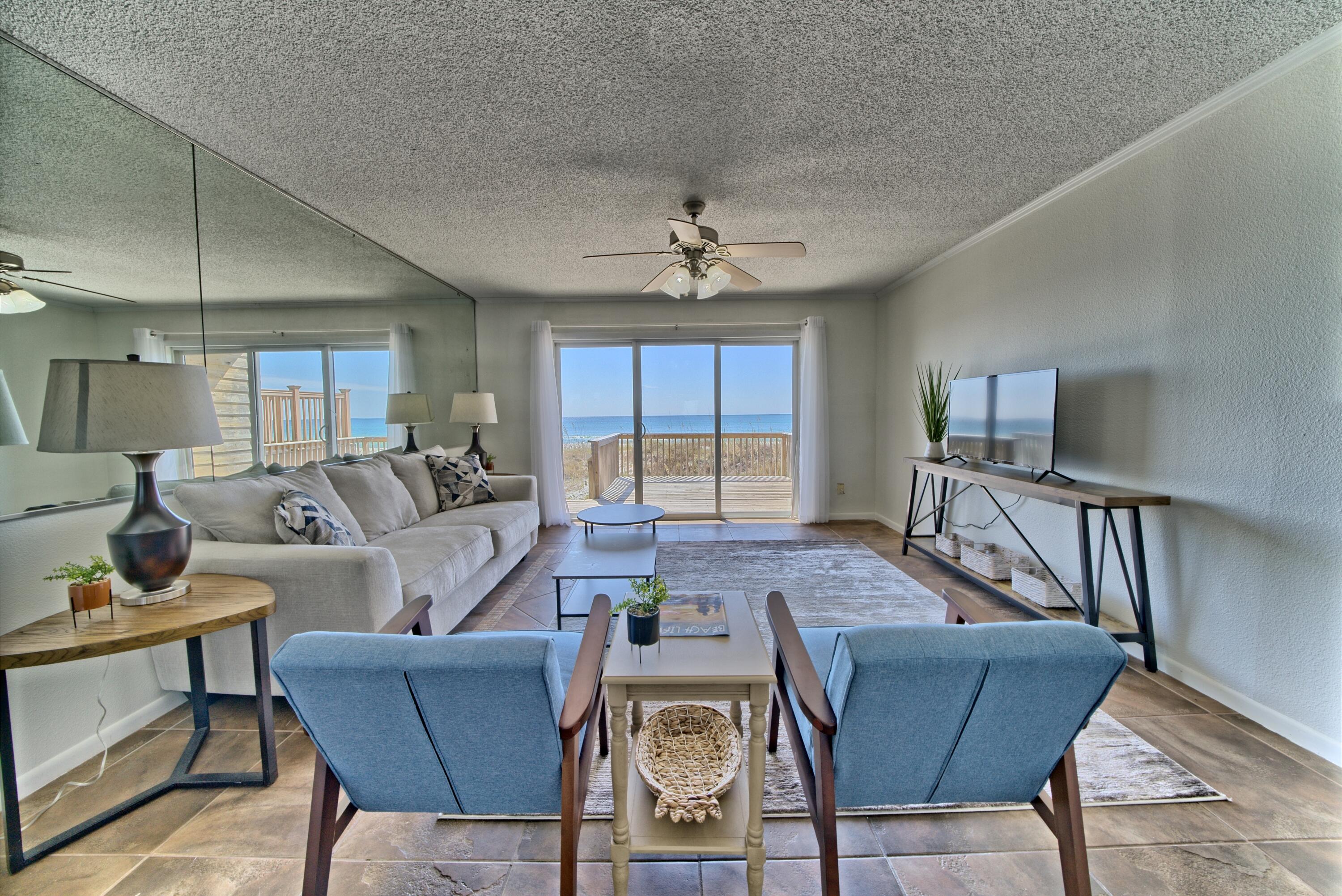 Motivated Seller- Beautiful 2 bedroom 2 bathroom townhouse  less than a mile from  Pier Park  and on the way to 30A with NO HOA. This vacation beauty boasts new furniture, new upstairs carpet, washer dryer combo, newly painted, new lower decking. This can be used as a primary residence, vacation rental or second home. This property is an investors dream with no HOA fees and plenty of parking. Picture yourself or a guest with a cup of coffee watching the sunrise or a beverage watching the sunset over the sandy beach.