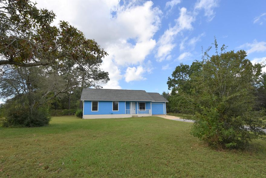 New Flooring, Fresh Paint, Newer Roof, and level ONE Acre! Enjoy your fenced back yard, Water view from your Front Porch, and a 1 Car Garage! Peaceful living with your 3 Bedroom, 2 Full Bathroom home; an eat-in Kitchen with pantry and a view to the Back Yard. Open patio off the back of the home is great for grilling and enjoying the tree lined lot. Schedule your private viewing today!