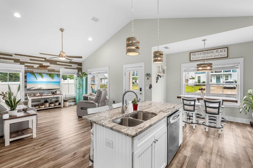 Enjoy life near the water in this turn-key home that is like brand new just a few minutes to the beach, close to North America's largest coastal dune Lake Powell on the West end of Panama City Beach.  Conveniently located to Pier Park, 30Avenue and 30A.  Featuring 2 beds, 2 baths, with almost 1200 sf of living space.  This charming residence sits on a quiet cul-de-sac in a neighborhood with new homes and infrastructure.  Inside a spacious living room with vaulted ceilings, a gorgeous accent shiplap wall, an area that flows into the open kitchen with granite topped island and beautiful white cabinets. The adjacent breakfast nook/dining room has unique and modern light fixtures. The owner's suite features a walk-in-shower, double vanity in the ensuite bath, and a walk-in closet A rear patio offers privacy fencing surrounding the property for your relaxation.  This home is ideal as a primary residence, short-term or long-term rental investment.  It's within walking distance to Lake Powell, where you can launch boats, jet skis and paddleboards, as well as Lake Powell Park.  Within 5 minutes, you can be in Rosemary Beach, shops and eateries at 30Avenue or Pier Park.