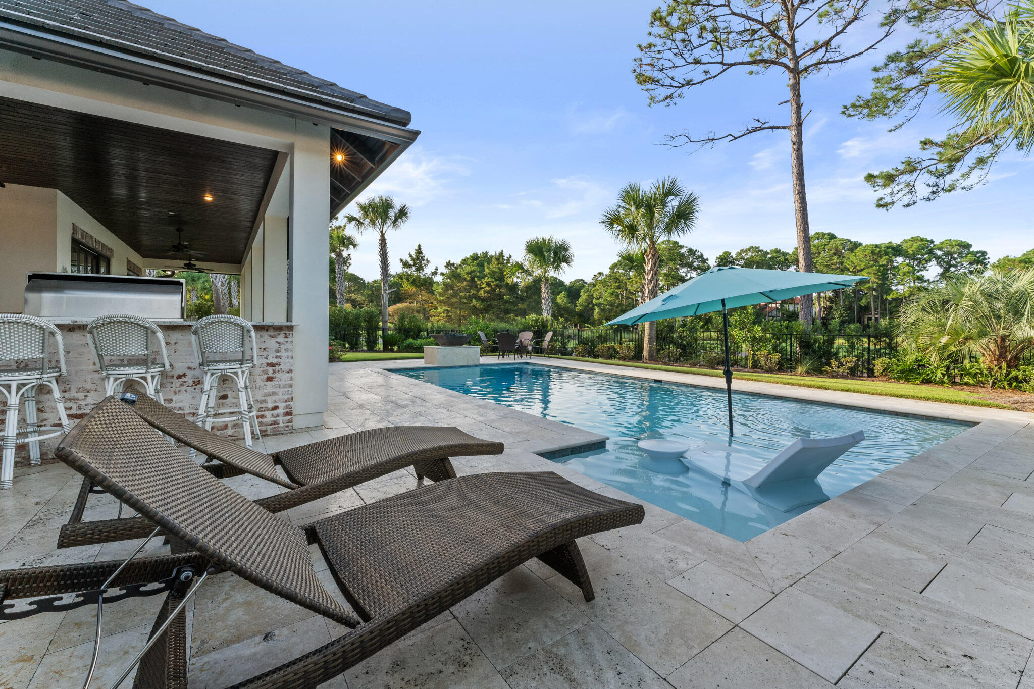 Come take a look at this exquisite one level home located within Sandestin Golf & Beach Resort. Custom built by Huff Homes in the spring of 2019, this home includes all the upgrades and features one could want. The U-shaped driveway and 2.5 car garage makes parking easy and you'll automatically notice the open concept layout and abundance of natural lighting once you walk through the front door. The stunning kitchen features a 10 foot island and luxury appliances such as a Wolf gas range oven & Sub-Zero refrigerator. Beautiful exposed brick flows from the kitchen to the main living area where you'll also find the wet bar. Each bedroom has its own full bathroom offering an abundance of privacy. In the spacious master bedroom, there's an office nook, walk-in closet, his and her vanities,