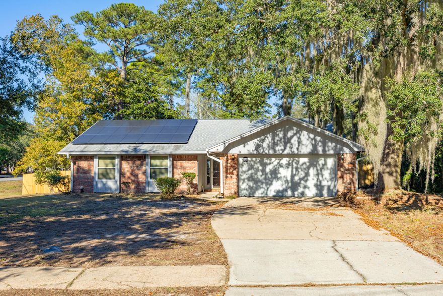 Spacious, 3 bed/2 bath brick home in the Pinewood Estate Subdivision.  A new roof & solar panels were installed in 2020.  The kitchen features plenty of counter space and cabinets.  There is a brick fireplace in the living room.  Large, fenced in back yard.  Located just minutes from schools, shopping and restaurants, not to mention the nearby marina with public boat launch, just down the street.  Seller can do a flooring allowance with an accepted contract.