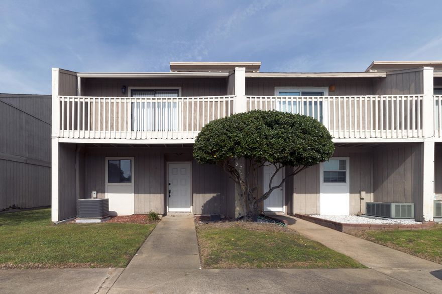 Great 2BR/2.5BA end unit townhome in Destin Racquet Club. This home features tile floors downstairs and new carpet upstairs. When you enter you are greeted by the kitchen and a large open living space. The kitchen has tile countertops, wood cabinetry, black appliances, and a breakfast bar. The dining and living area have a fireplace & access to the back porch with a covered sitting area. Upstairs there is the master suite which features a large tile surround tub/shower & a private balcony overlooking the airport. The second bedroom has 2 closets & a private balcony. There is also a hallway full bath upstairs. Other features include laundry area, and a half bath downstairs. This would make a great first home or rental property.