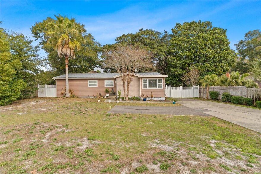 Home in the heart of Destin. 3 bedrooms and 2 full baths. Kitchen has granite counter tops and breakfast bar. Hardwood floors have recently been refurbished. Utility room with washer & dryer connections. Large recreation/family room with built in bar. Family room opens to a large shady fenced in back yard.  Conveniently located to schools, boat launch, parks, shopping, dining and attractions, the Destin harbor and the beaches. Being sold #AS IS''.