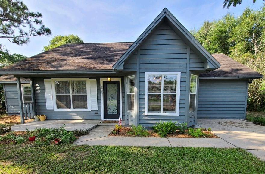 South of I-10 you can purchase this place and boast to all your friends about your new comfy home. This one has a cute cute layout with a bonus room/craft room or school room. Most everything in the home has been updated and has that special touch. The kitchen has solid surface counters, stainless steel and wall shelving for extra dishes. All the fixtures are totally posh and the flooring is the smooth vinyl wood look. You'll love this cool country home with so much space outside for children, animals, and even a garden. The guest bath has bead board on the walls and a gorgeous tiled shower. The large master has a dressing area with an all black and white bathroom to include counter tops, floors and tiled black and white shower.Lots of windows to let all the natural light in.