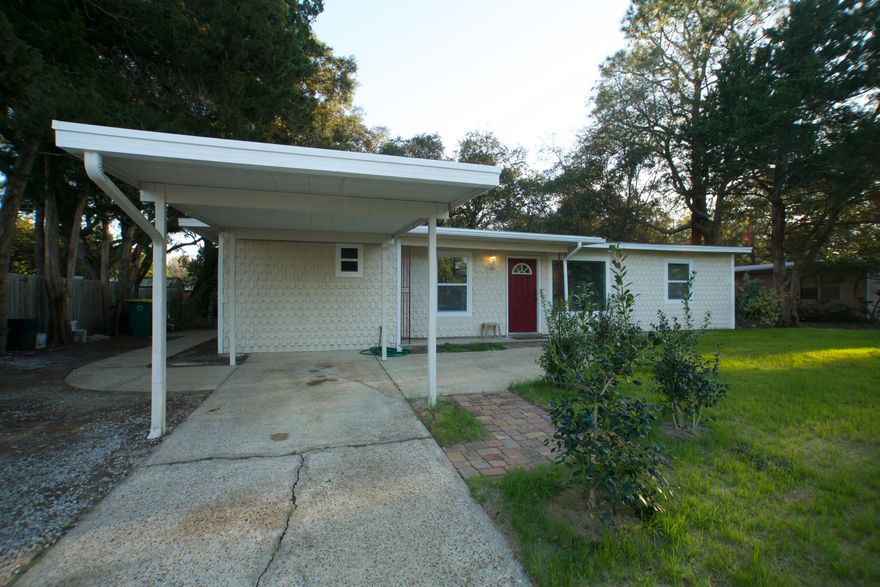 Recently renovated, this 3-bedroom 2 full bath is centrally located in Ocean City Fort Walton Beach, Fl. The home is positioned on an impressive size lot with beautiful winding trees and lush greenery. The oversized driveway along with the side of the property is ideal for parking a RV or boat. The home showcases a large 5' x 5' window anchored in the living room that allows natural sunlight to amplify the light toned color scheme. Other noteworthy features include the master suite; the entire left wing is dedicated to the master suite which comes equipped with an extra small room perfect for a nursery or lounge area. Also, having a split floor plan allows for the master suite to be separate from the 2 additional bedrooms to provide privacy and sound nights. The back yard in completely