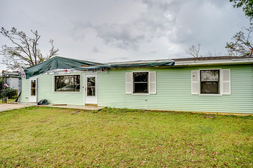 ***Attention Investors***Cinderblock under vinyl siding. Good location! Nice size lot! Plenty of space for everyone! The carport was converted into a bonus room, that could easily be used as an office, extra bedroom, den, playroom or even converted into a garage. There was also another addition added for extra living space! With some TLC, the home would make a great primary home, or rental. The house was damaged in the hurricane, and needs some work. Being sold ''As Is'' with right to inspect, and Cash only. Bring an offer! Won't last long! All measurements approximate, please verify if important.