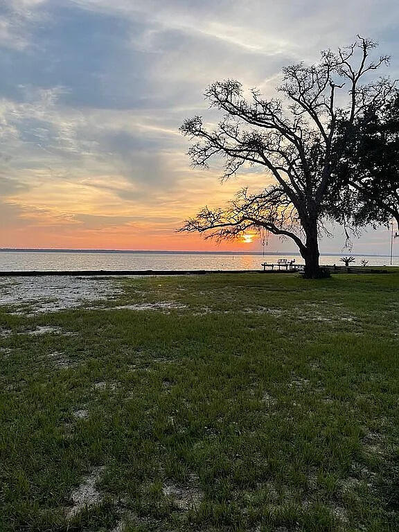 Beautiful waterfront lot on Escambia Bay. It is a .59 acre clear lot with a few shade trees and 104' on the water. An elevation survey has been completed so you're ready to design and build your dream home. Stunning sunsets and direct access to the Gulf. Boat, fish, swim, relax, all from your backyard. Located on a quite road with no through-traffic.